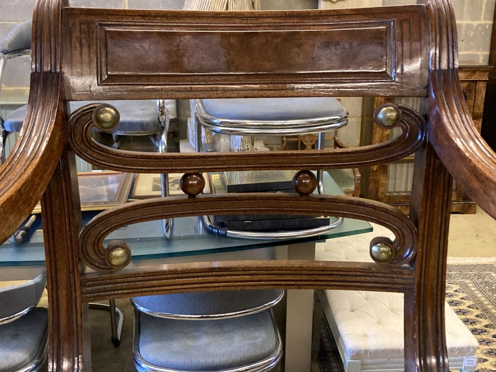 A set of eight Regency mahogany dining chairs (two with arms)